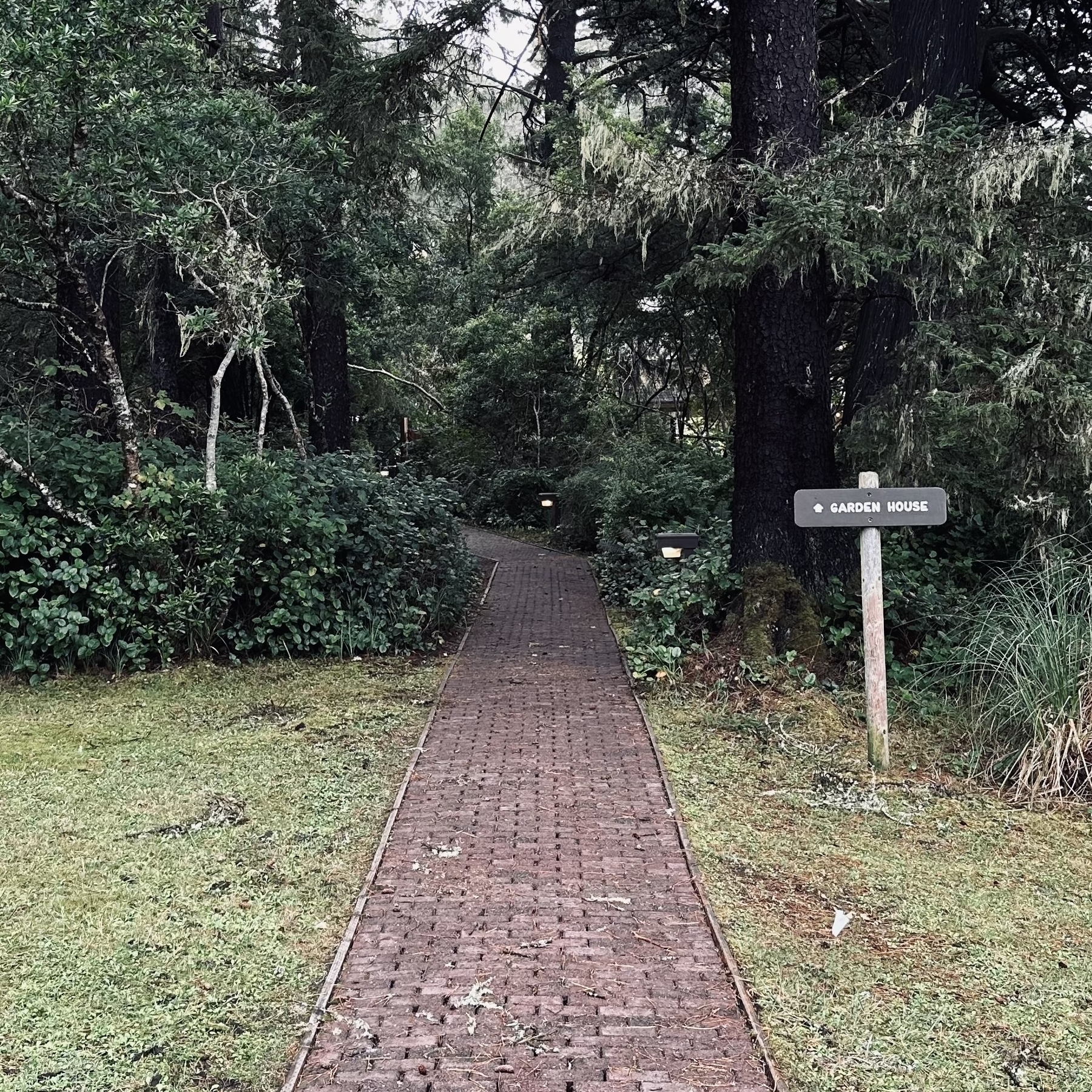 Path leading to the gardens with sign