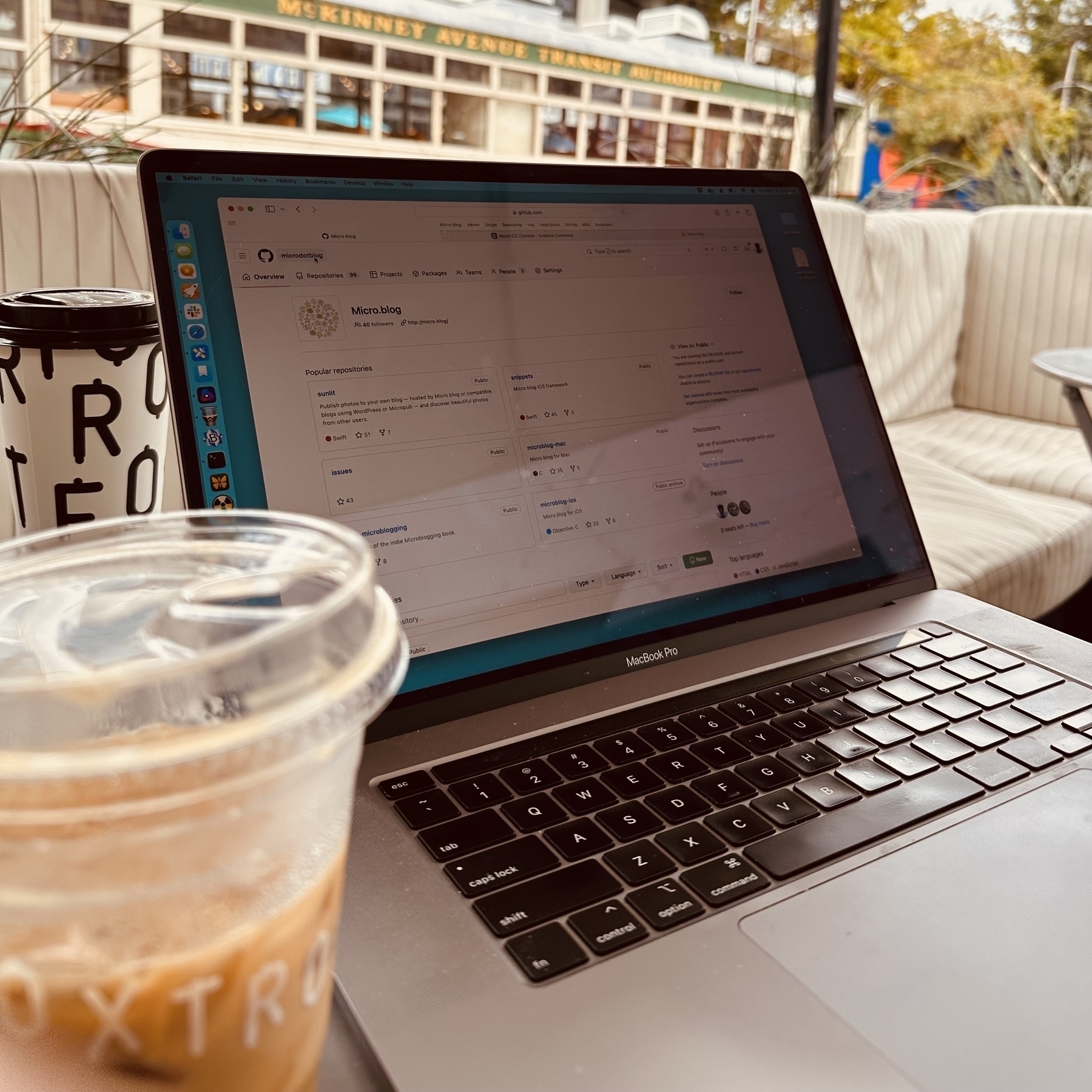 Coffee and laptop outside.