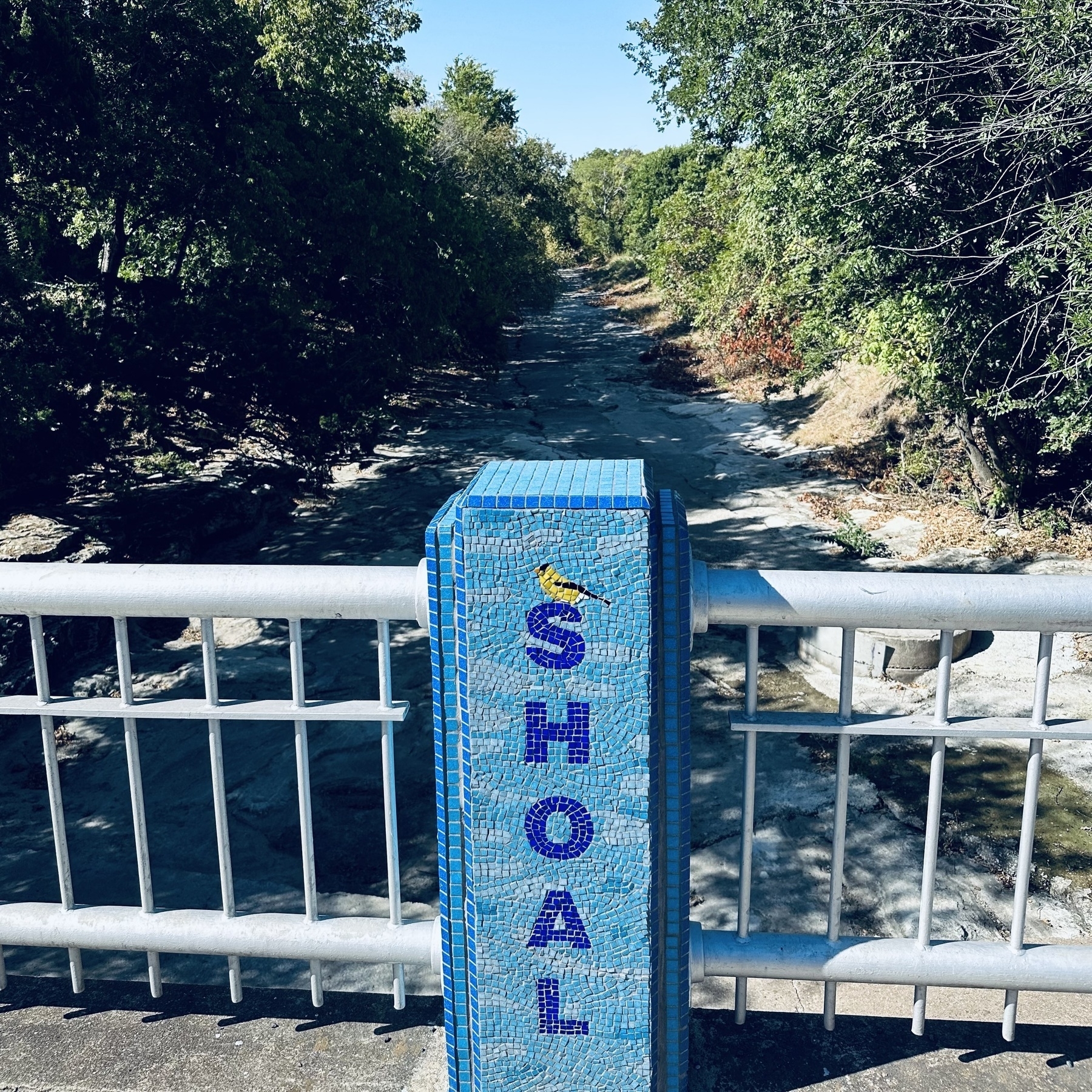 Mosaic post on bridge with Shoal on it.