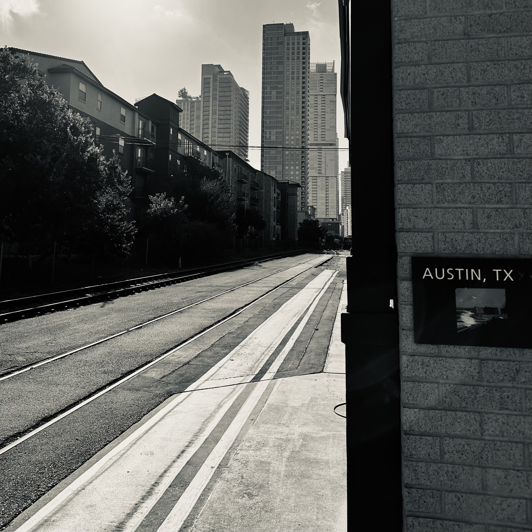 View of tracks and downtown Austin. Black and white.