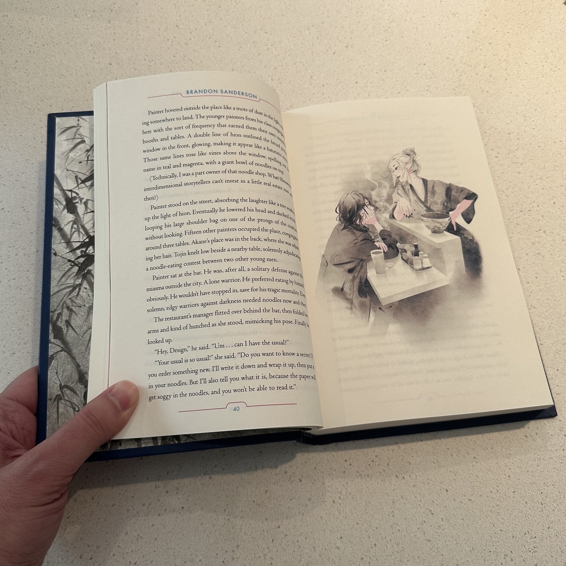 Photo of book open with illustration.