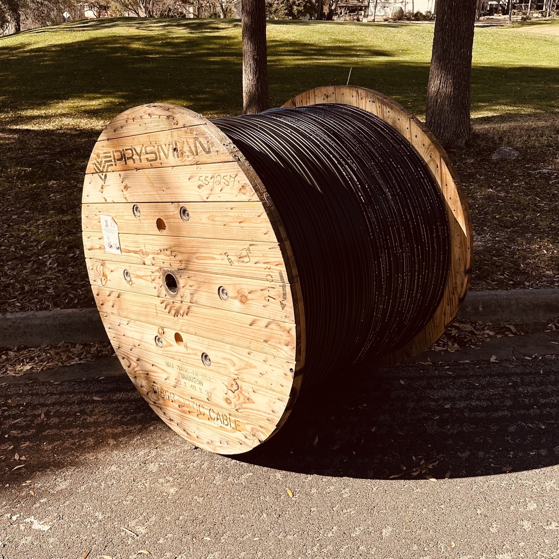 Big coil of cable on the street.