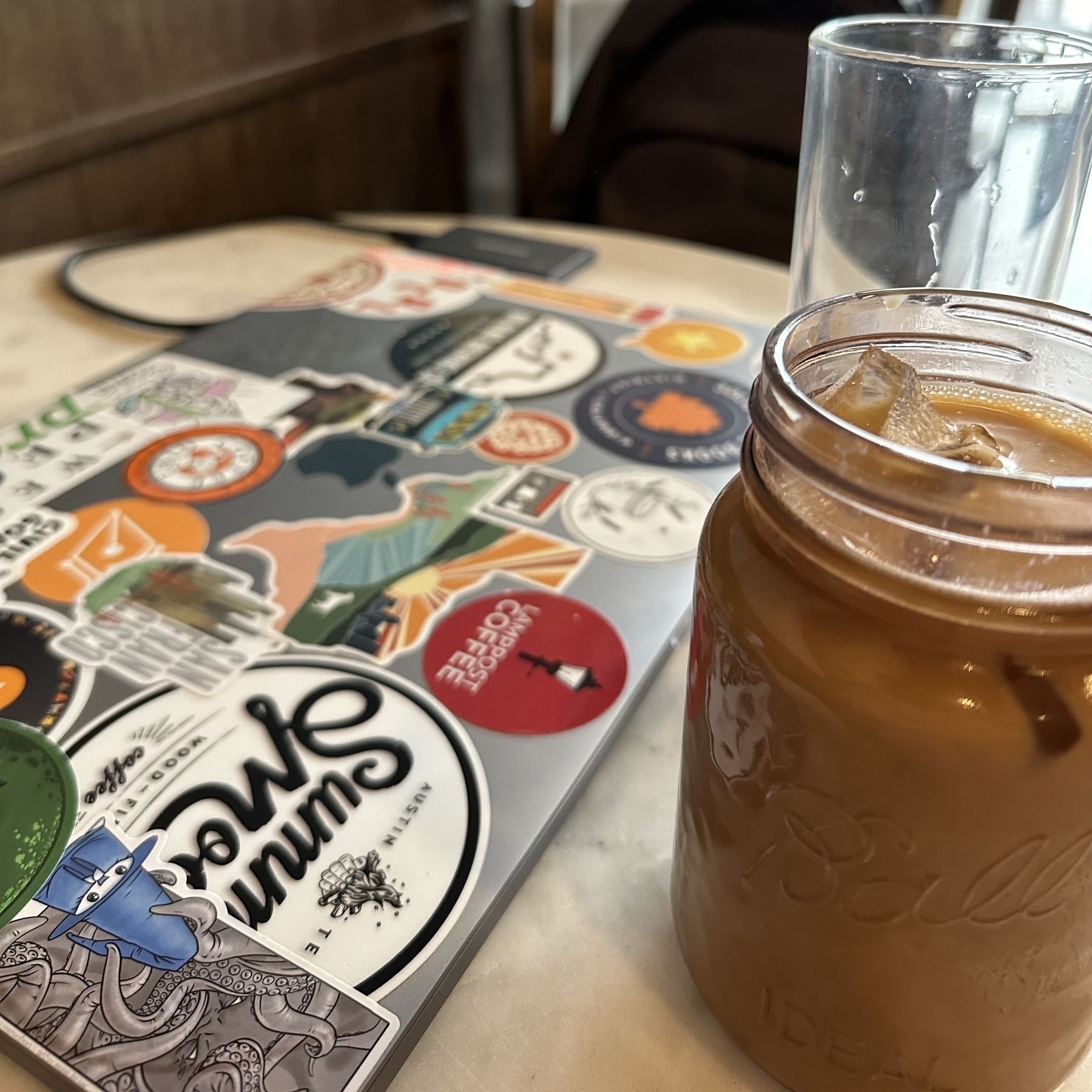 Iced coffee and laptop.