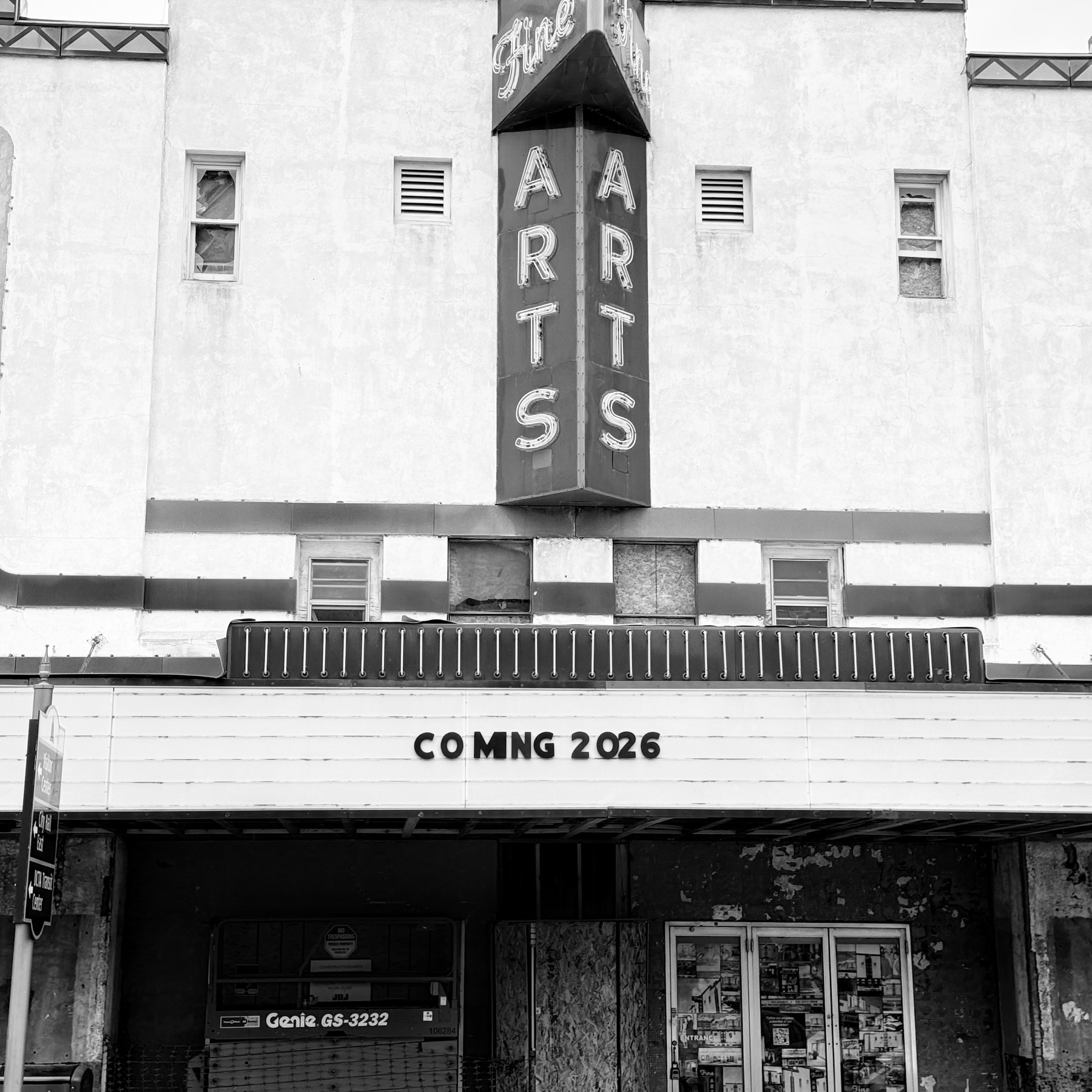 A vintage theater facade features a vertical Fine Arts sign and a marquee displaying COMING 2026.