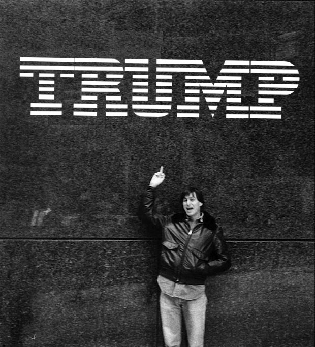 An edited photo from the time that Steve Jobs gave the middle finger to an IBM logo on a trip to New York City, but the IBM logo is replaced with TRUMP in a similar font.