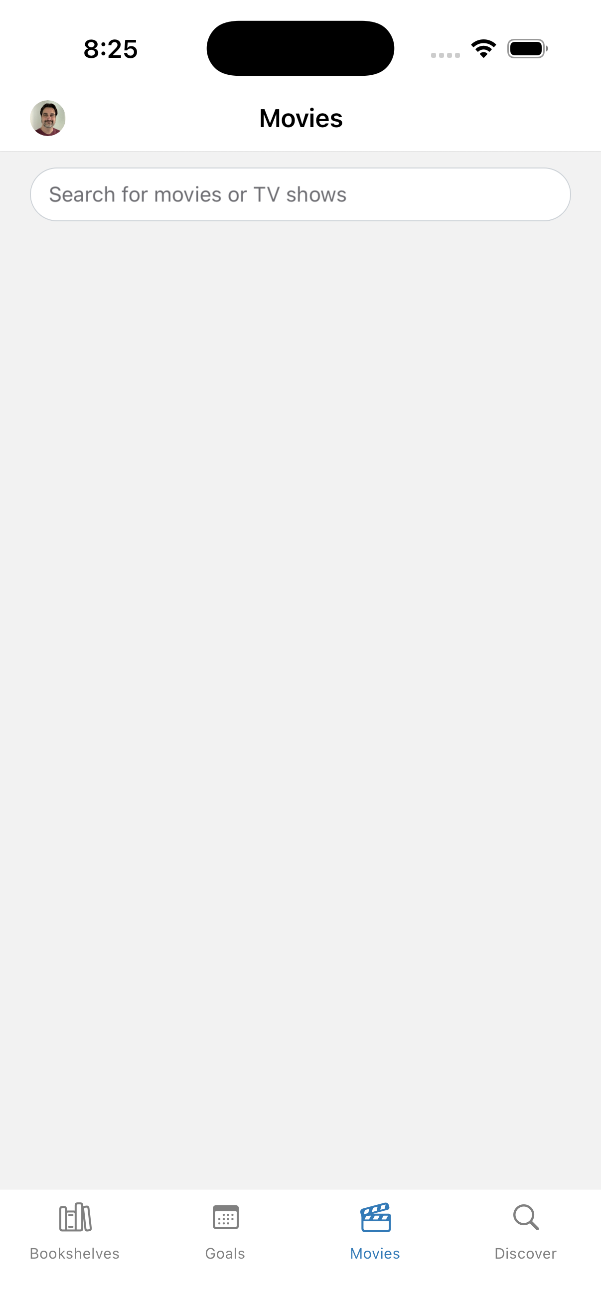 A mobile app interface is displayed showing a Movies tab with a search bar and navigation options at the bottom for Bookshelves, Goals, Movies, and Discover.