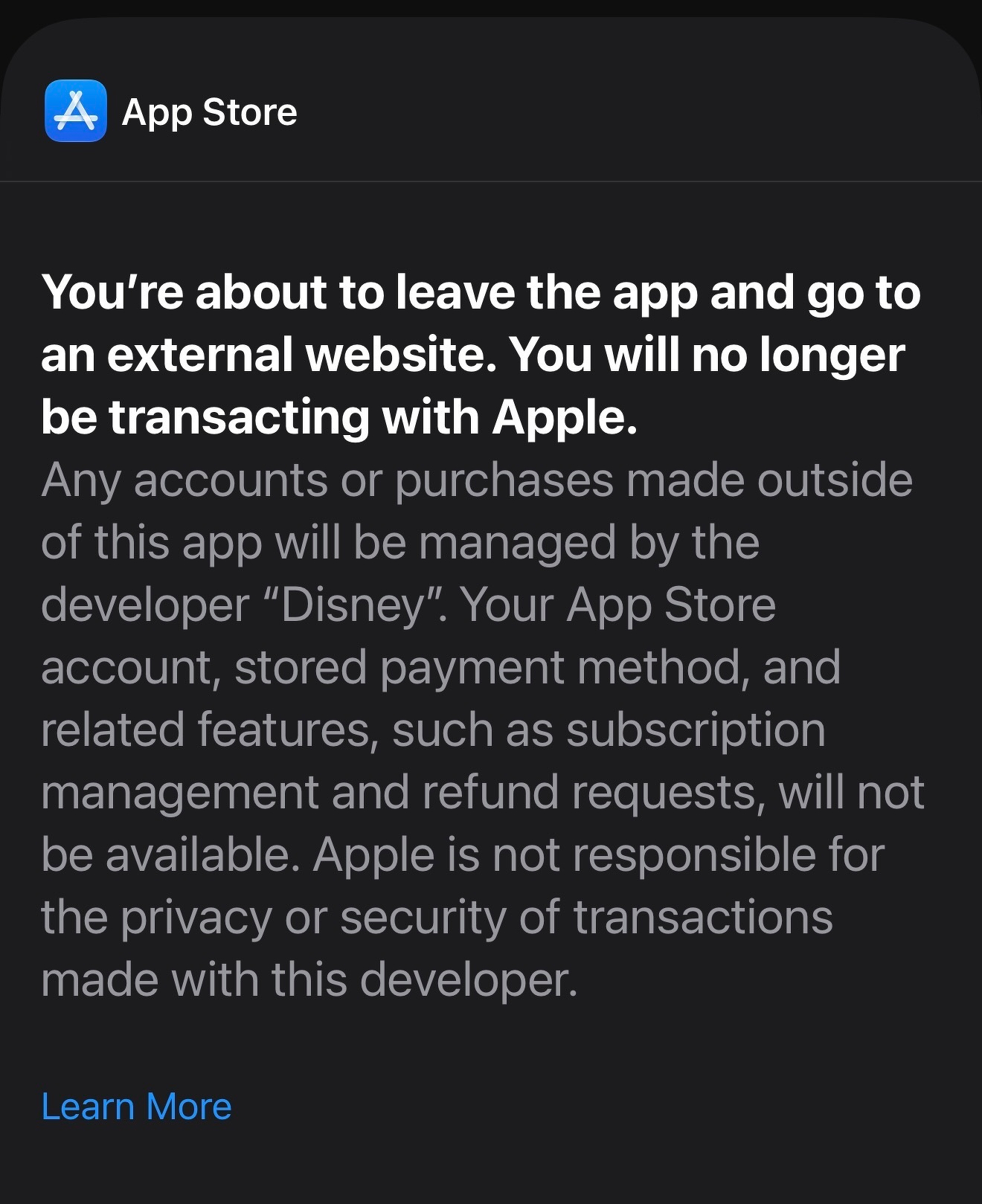 A warning message from the App Store informs users that they are about to leave the app to visit an external website operated by Disney and that transactions made there will not involve Apple.