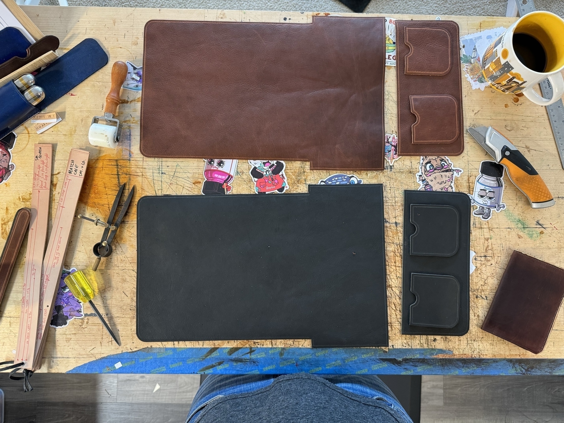 Workbench covered in leather orders in progress. 