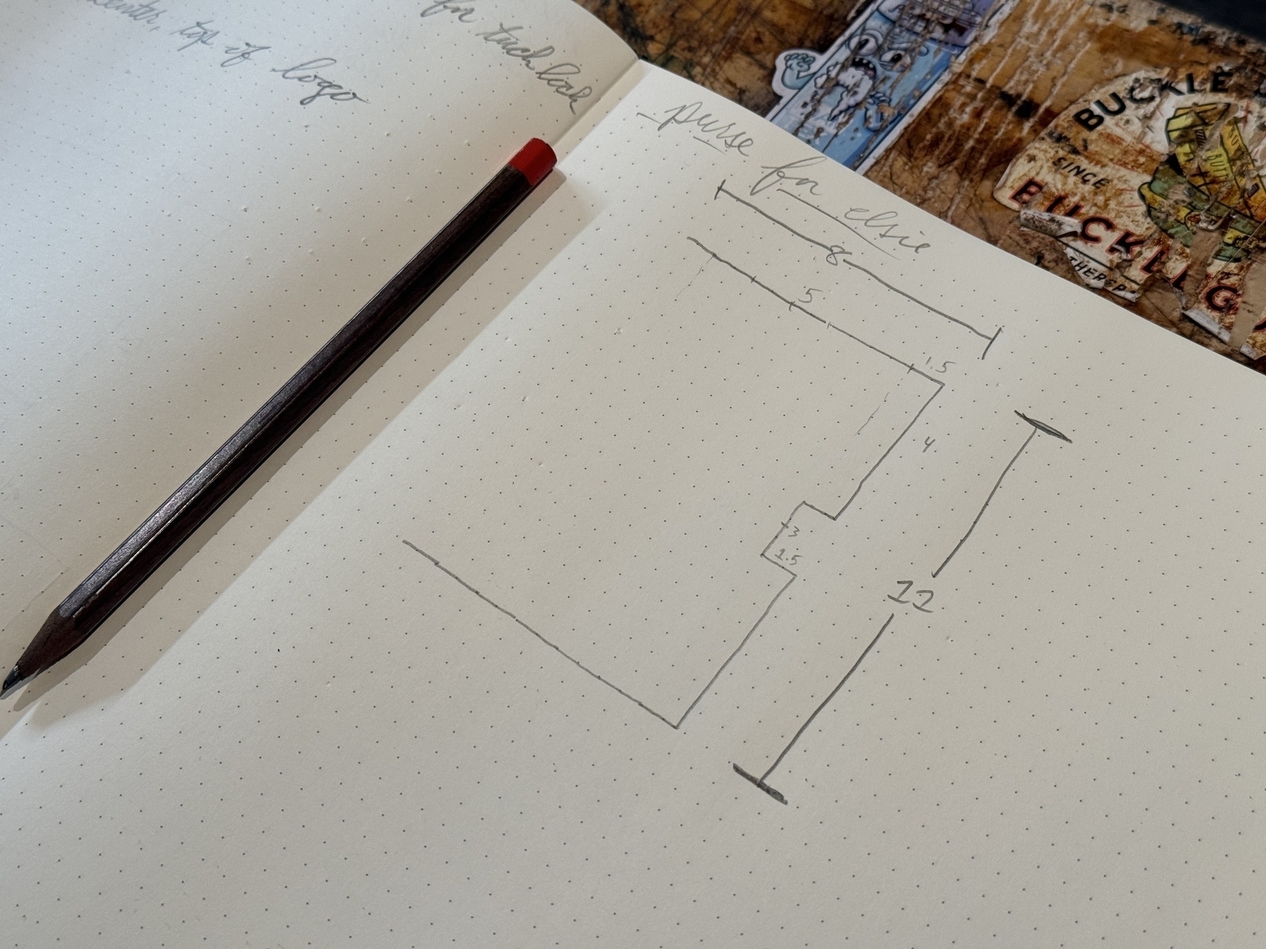 A notebook with a pencil on the left displays a sketched diagram featuring measurements beside handwriting at the top.