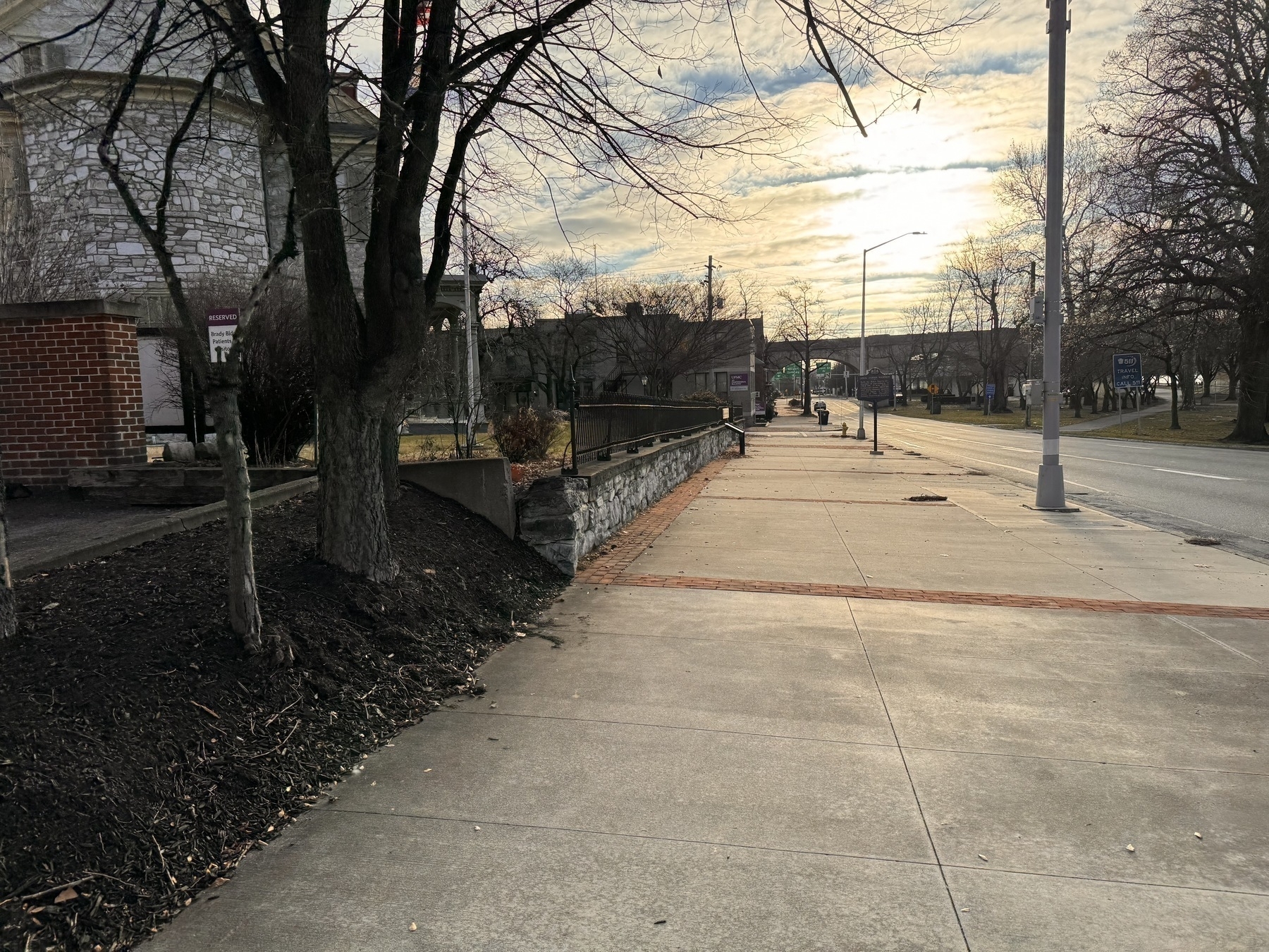 Photo from my walk this morning along Front street in Harrisburg Pennsylvania. John Harris Mansion is to the left, cloudy sky above with the sun shining through.