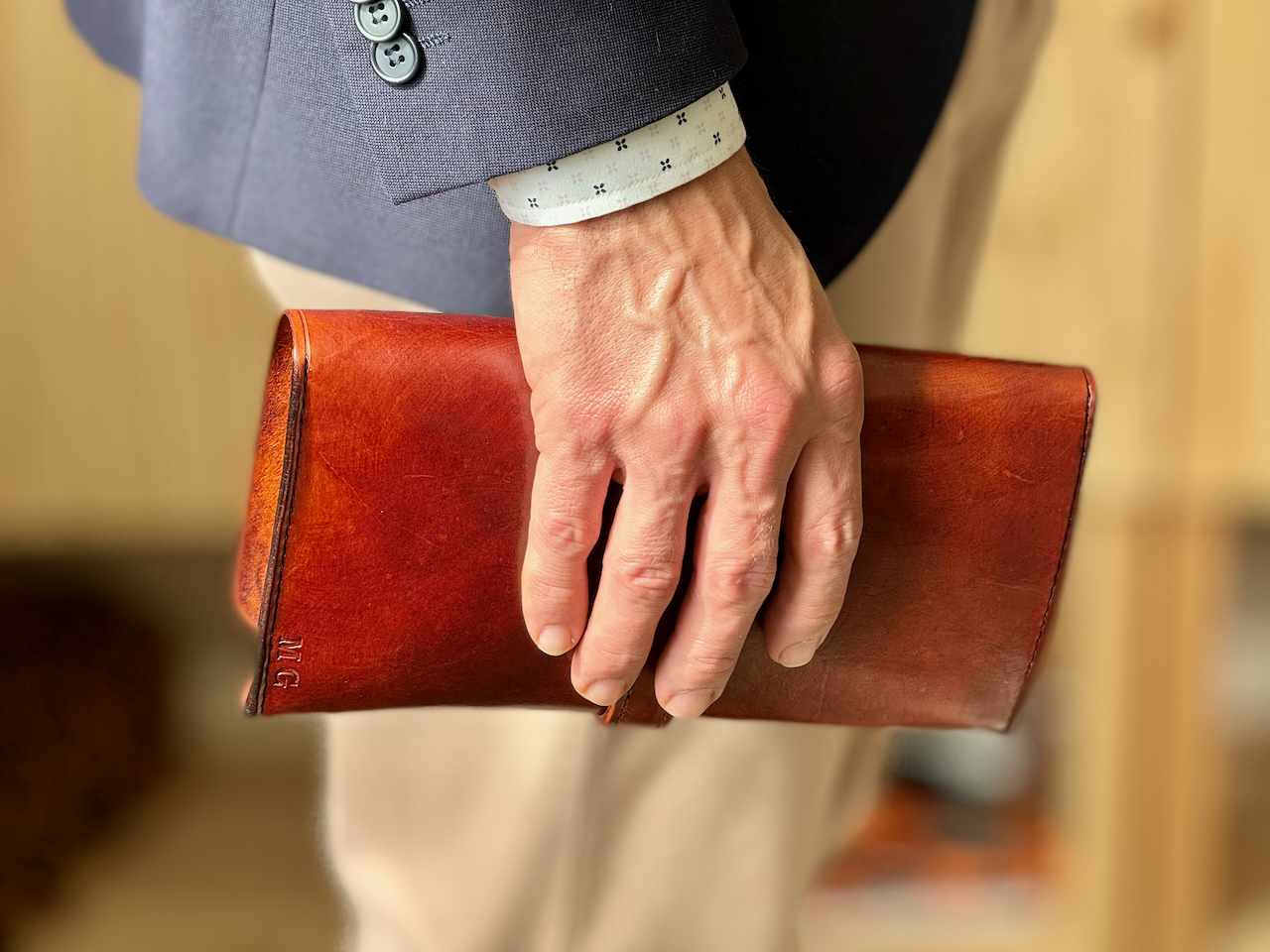 Leather boveda cigar case being held in hand