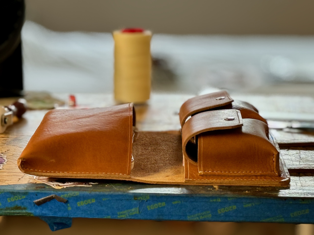 Image showing leather cigar case flapped open, perspective is to show the height of each pocket which is about 1 inch when in use.