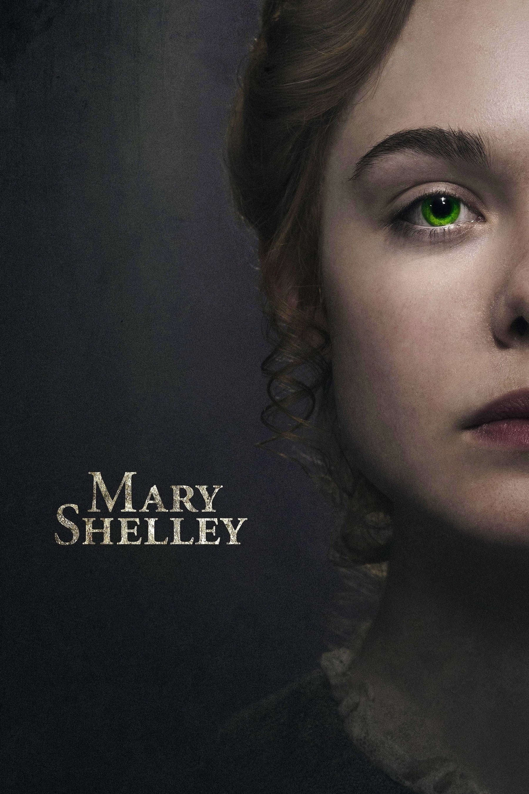 A close-up image of a woman's face, focusing on her striking green eye and partial view of her lips. Her hair is styled with curls. The background is dark, creating a dramatic contrast. The text "Mary Shelley" is prominently displayed on the left side of the image.