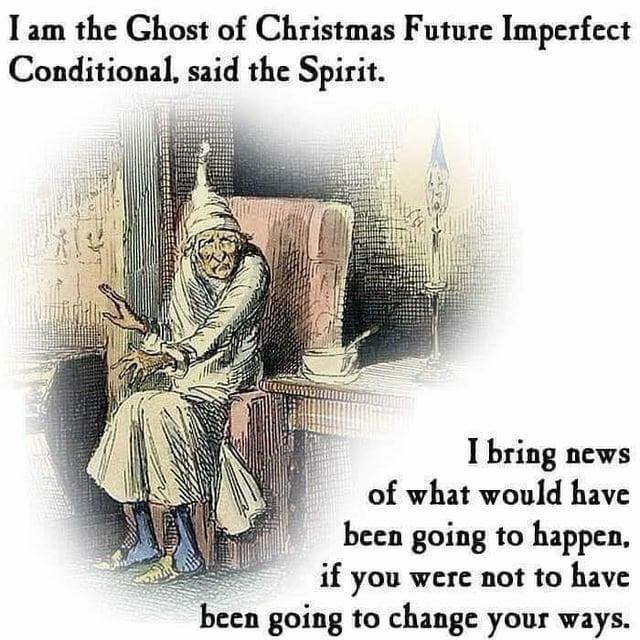 A ghostly figure in a robe and cap is seated in a dimly lit room with a candle on a small table nearby. The text above reads, "I am the Ghost of Christmas Future Imperfect Conditional, said the Spirit." Below it says, "I bring news of what would have been going to happen, if you were not to have been going to change your ways."
