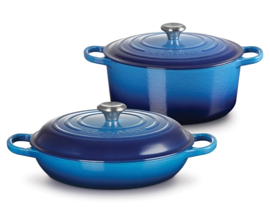 Two blue cookware pieces with lids, featuring handles on the sides and a shiny knob on top.