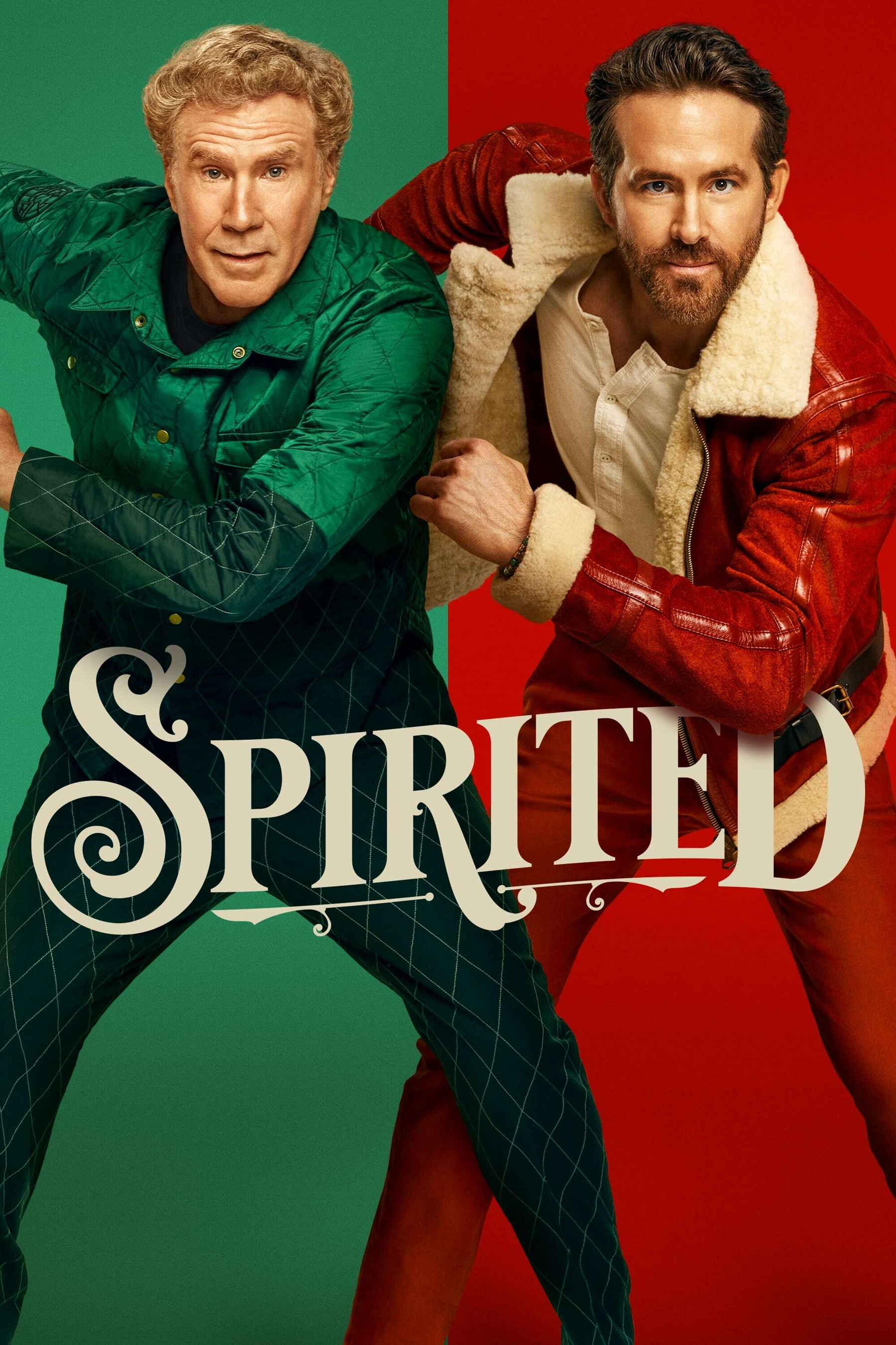 Two men pose energetically against a split green and red background. The man on the left wears a quilted green jacket and pants, while the man on the right wears a red and white fur-lined jacket with red pants. The stylized word "Spirited" is overlaid on the lower part of the image.