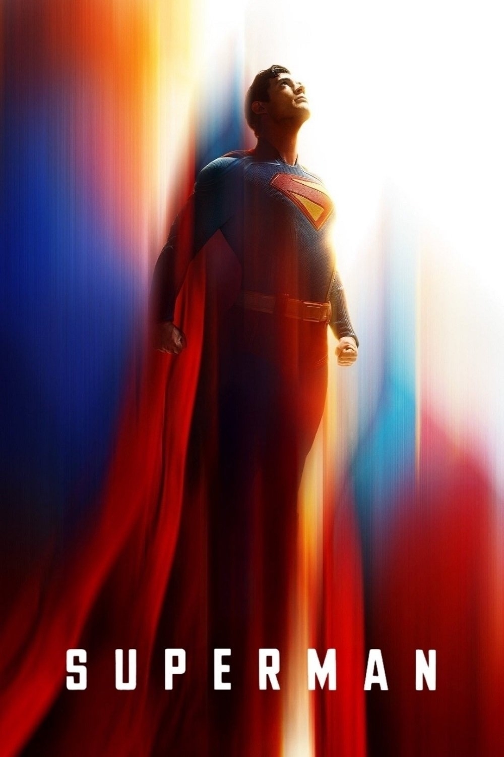 Poster featuring Superman, standing confidently with a flowing red cape. His suit is blue with the iconic yellow and red "S" emblem on the chest. The background has a blend of vibrant colors and light, and the word "Superman" is displayed at the bottom in bold white letters.