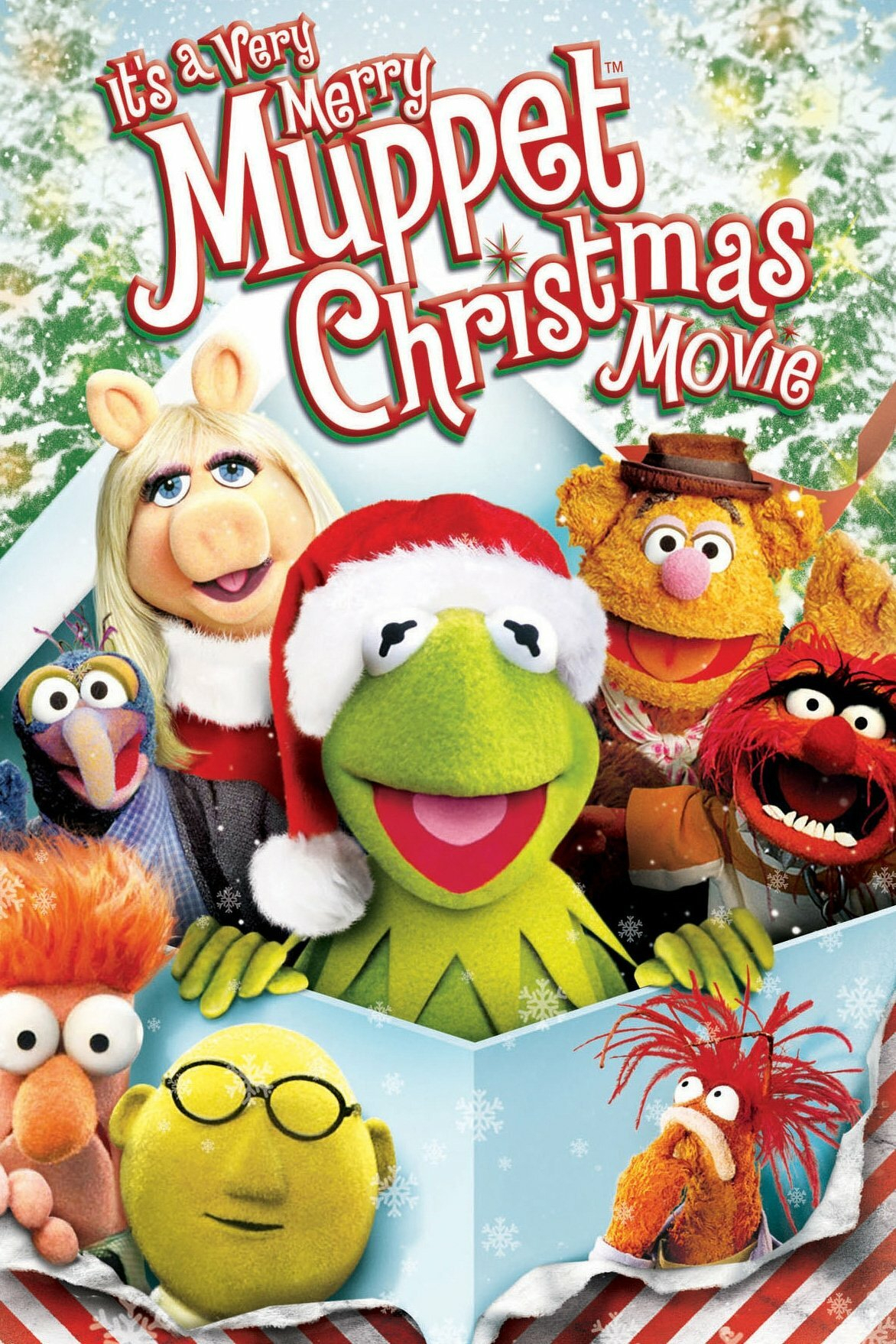 A festive movie poster featuring a group of colorful Muppet characters. The central character, a green frog wearing a Santa hat, is smiling joyfully. Surrounding him are other Muppets, including a pig with blonde hair, a yellow bear in a hat, and a blue creature with a large nose, among others. They are all against a snowy winter backdrop with a decorated Christmas tree. The title at the top reads "It's a Very Merry Muppet Christmas Movie" in red and white text. Snowflakes and holiday decorations enhance the cheerful theme.