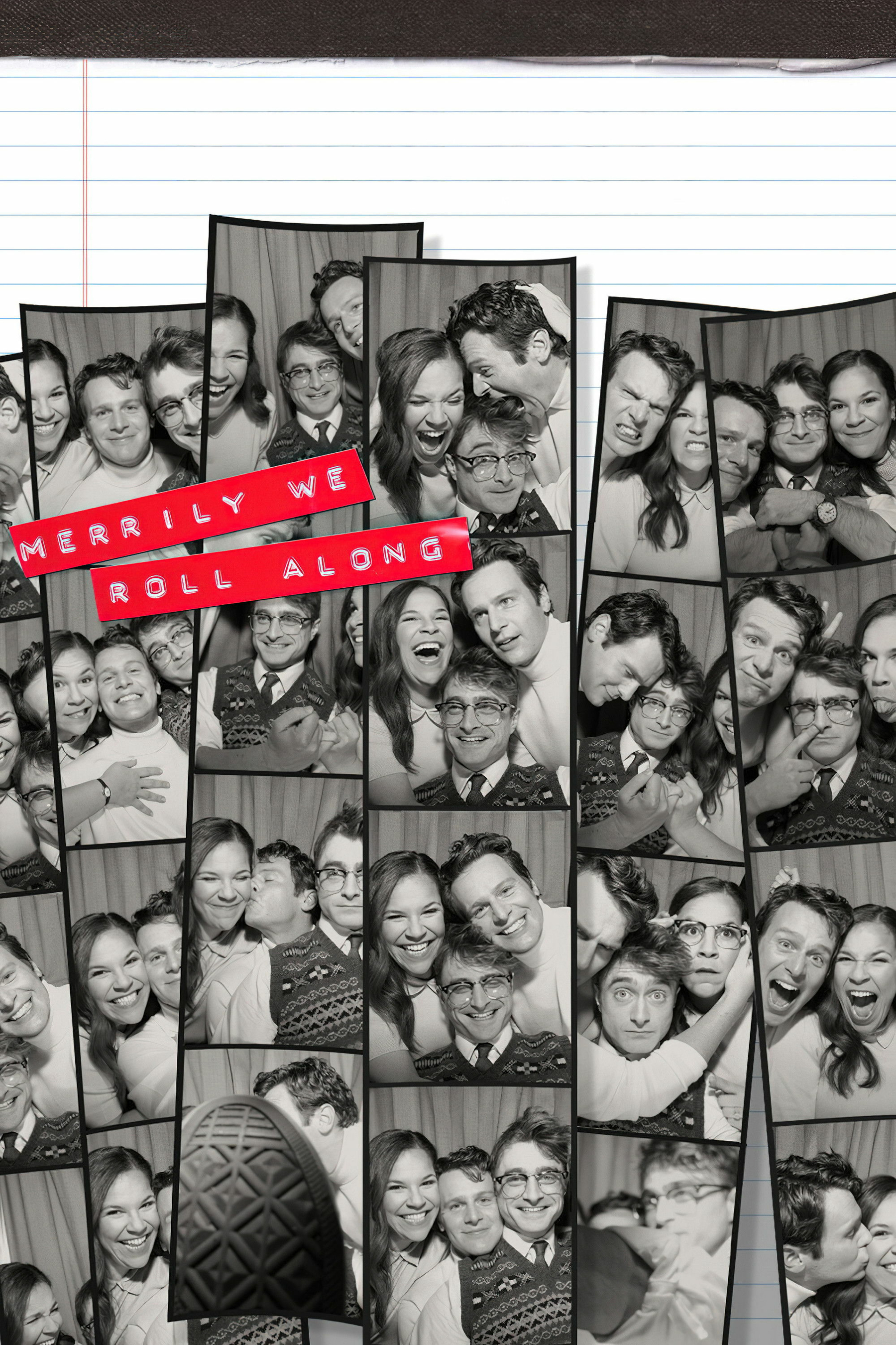 A collage of black and white photo booth images featuring three people having fun. They are making various silly and joyful expressions, such as smiling, laughing, and hugging. One person is wearing glasses and a patterned sweater, the second person is smiling widely, and the third person is animated, with playful gestures. The phrase "Merrily We Roll Along" is written in red on top of the images.