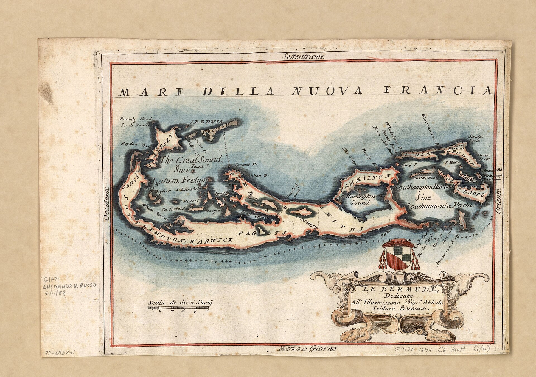 An antique, hand-coloured map titled “Le Bermudi” showing the islands of Bermuda, surrounded by the ocean shaded in blue. The map is oriented with north at the top, labelled “Settentrione,” and south at the bottom, labelled “Mezzo Giorno.” The surrounding seas are named “Mare Della Nuova Francia” at the top, “Occidene” on the left, and “Oriente” on the right. Various geographic features and settlements are marked, including “The Great Sound, Siue Parsi I,” “Latum Freum,” “Hamilton,” “Pagets,” “Hampton Warwick,” “Isola Devono,” “St. David,” and “Southampton Harbour Siue Southampton Portu.” Several smaller islands are illustrated, such as “Daniels Island” and “Ibernia.” A decorative compass rose and a coat of arms with a red, white, green, and black shield appear in the lower right corner, framed by ornate scrollwork. A scale marked “Scala de dieci Stadj” is included at the bottom left. The map has a red border and shows signs of aging, with visible foxing and faded edges.