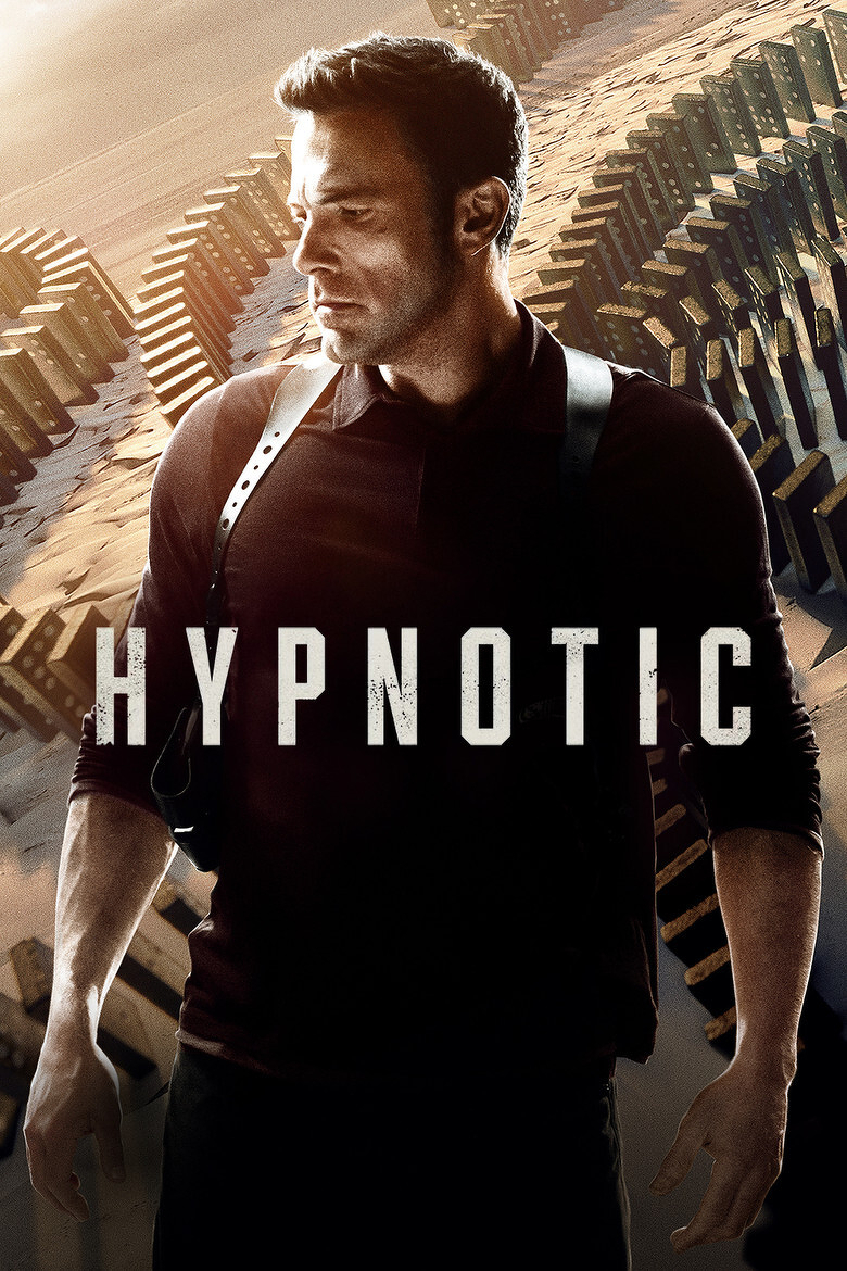 A man wearing a black long-sleeve shirt and a shoulder holster stands with a focused expression, looking to his right. His pose is tense, with his arms slightly away from his body. Behind him, a surreal landscape of massive, curved domino-like structures stretches into the distance under a warm, glowing sky. The word "HYPNOTIC" is prominently displayed across the centre of the image in bold, white letters with a slightly weathered texture.