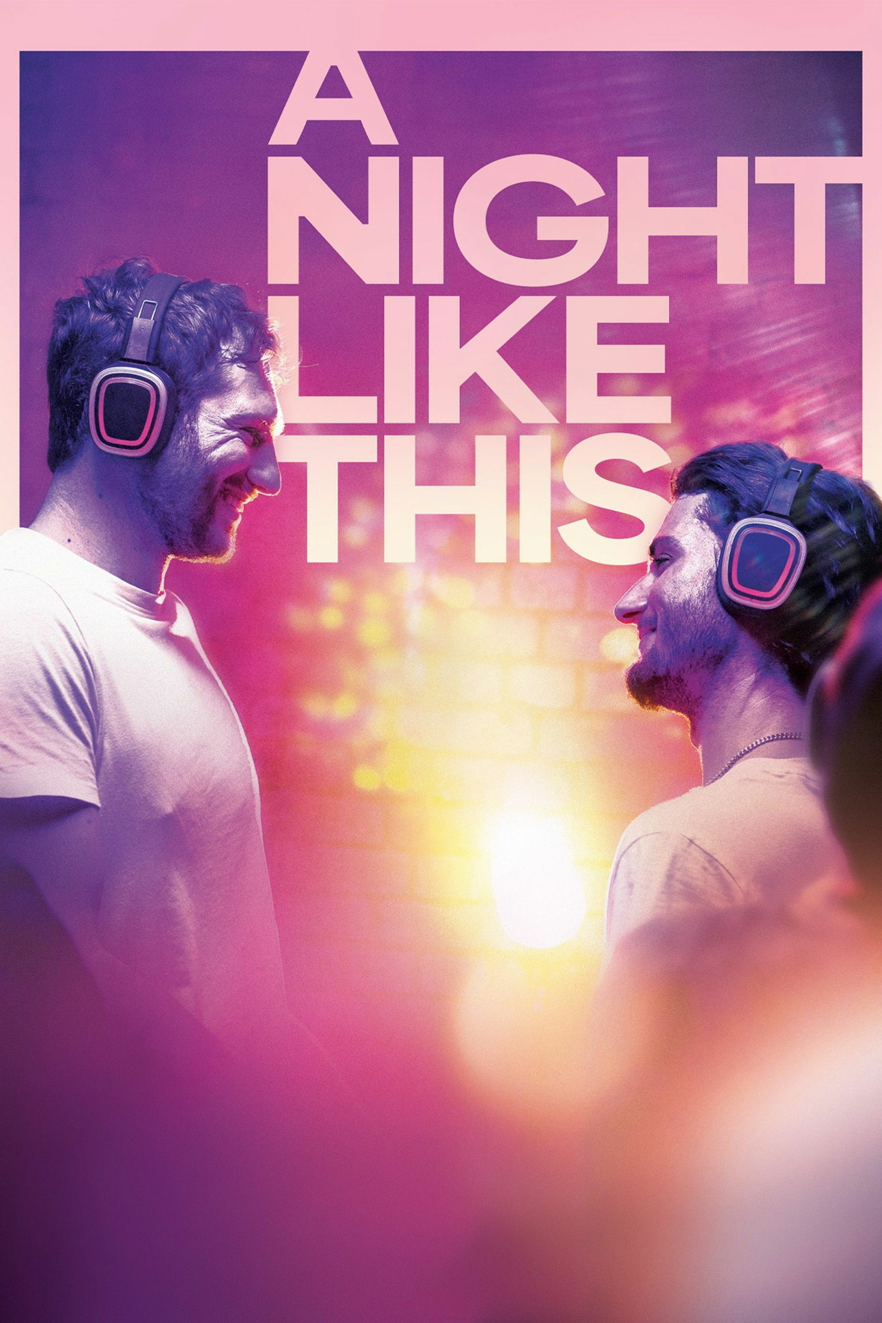 Two people facing each other, wearing headphones and smiling, against a vibrant background of pink and purple hues. The words "A Night Like This" are prominently displayed above them. The image conveys a sense of joy and connection.&10;