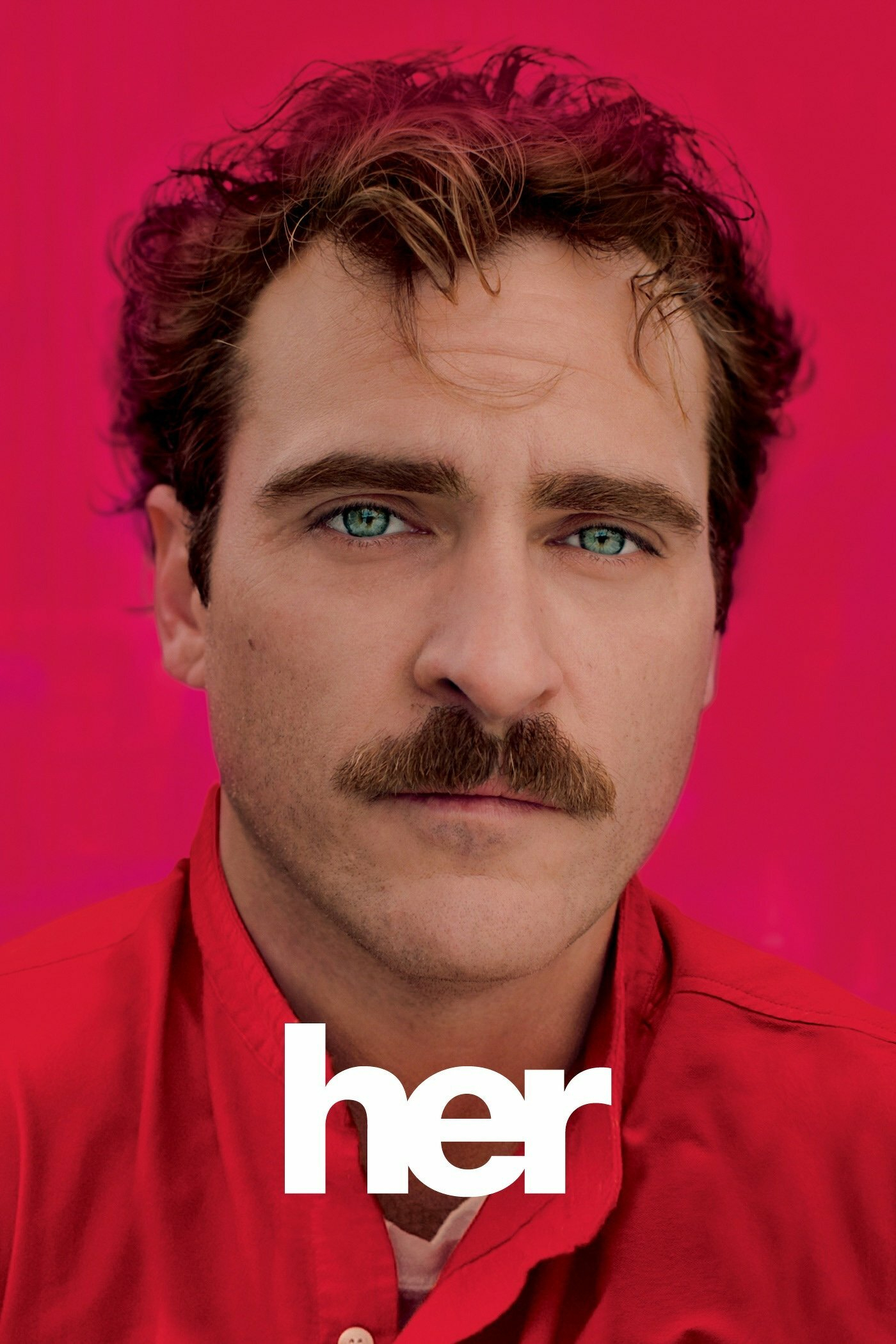 Close-up of a man with light eyes and a mustache, wearing a red shirt against a red background. The word "her" is prominently displayed across the lower part of the image in white text.