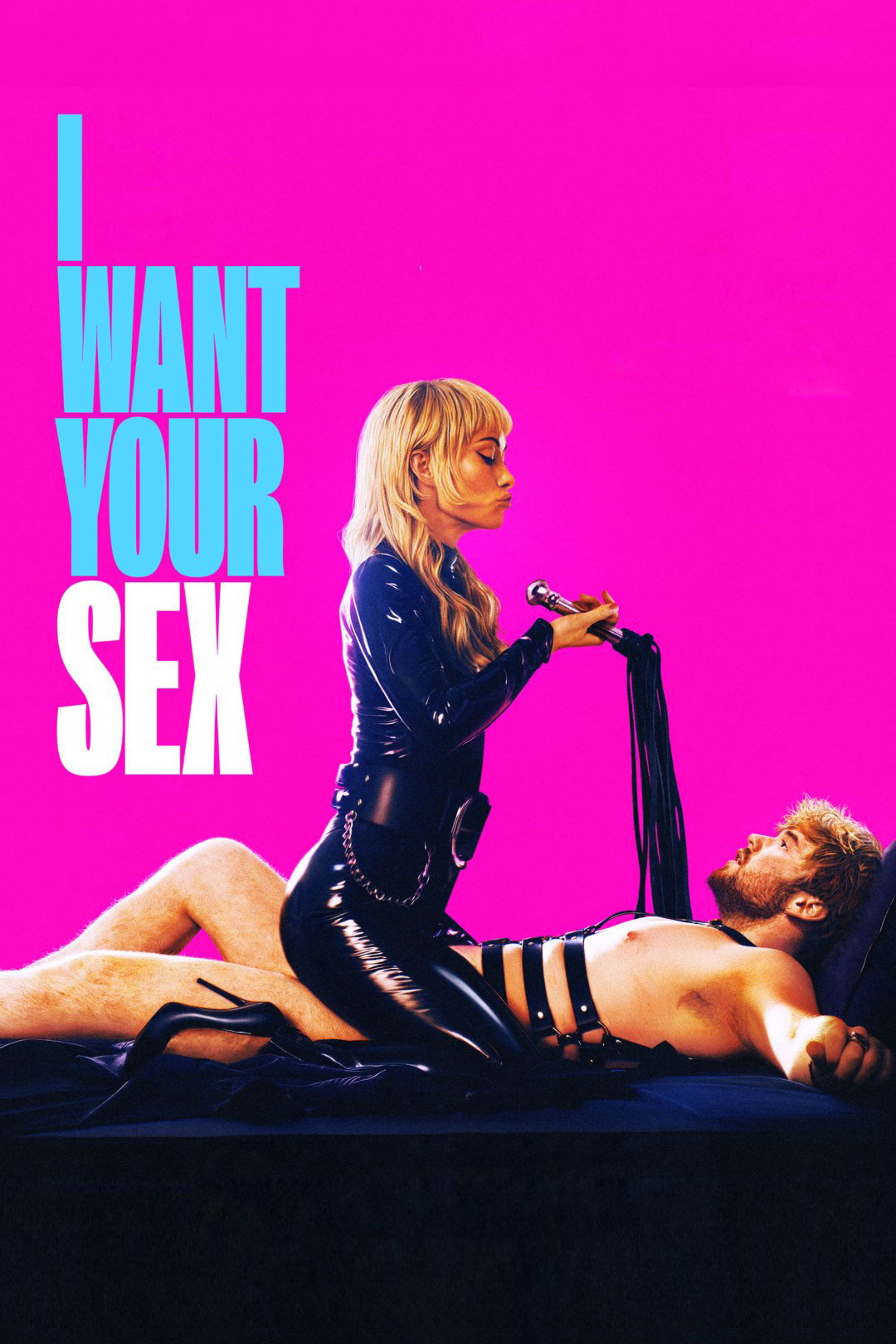 A woman dressed in black latex holds a whip while a shirtless man lies on a bed with restraints against a bright pink background with bold text saying I WANT YOUR SEX.