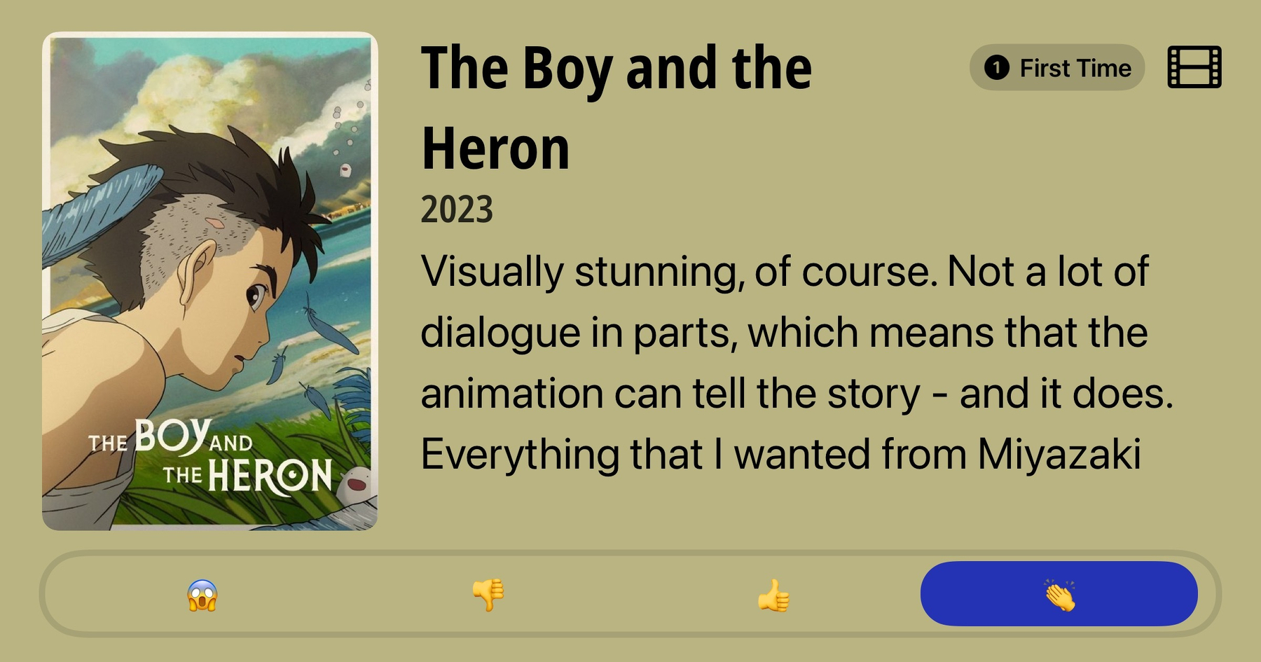 Movie poster for 'The Boy and the Heron' shows a young boy with short, spiky hair looking to the right. Blue feathers are scattered around him against a backdrop of green grass and a partly cloudy sky. Text reads: 'The Boy and the Heron', 2023. Accompanying review mentions the film is 'visually stunning', with minimal dialogue, allowing the animation to tell the story. Reaction emojis include a shocked face, thumbs down, thumbs up, and clapping hands.