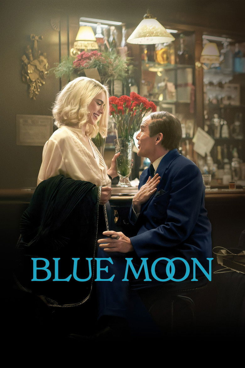 A man and a woman are in a warmly lit bar, surrounded by vintage décor and hanging lamps. The woman has shoulder-length blonde hair and is wearing a cream satin blouse, holding a black coat draped over her arm, and smiling down at the man. The man, seated on a barstool, is wearing a dark blue suit and gazes up at her with one hand over his chest and the other resting on his knee, holding a cigar. Behind them is a vase of red flowers on the bar, and shelves filled with various bottles, glasses, and decorations. The words "BLUE MOON" are displayed across the bottom in large, light blue capital letters.