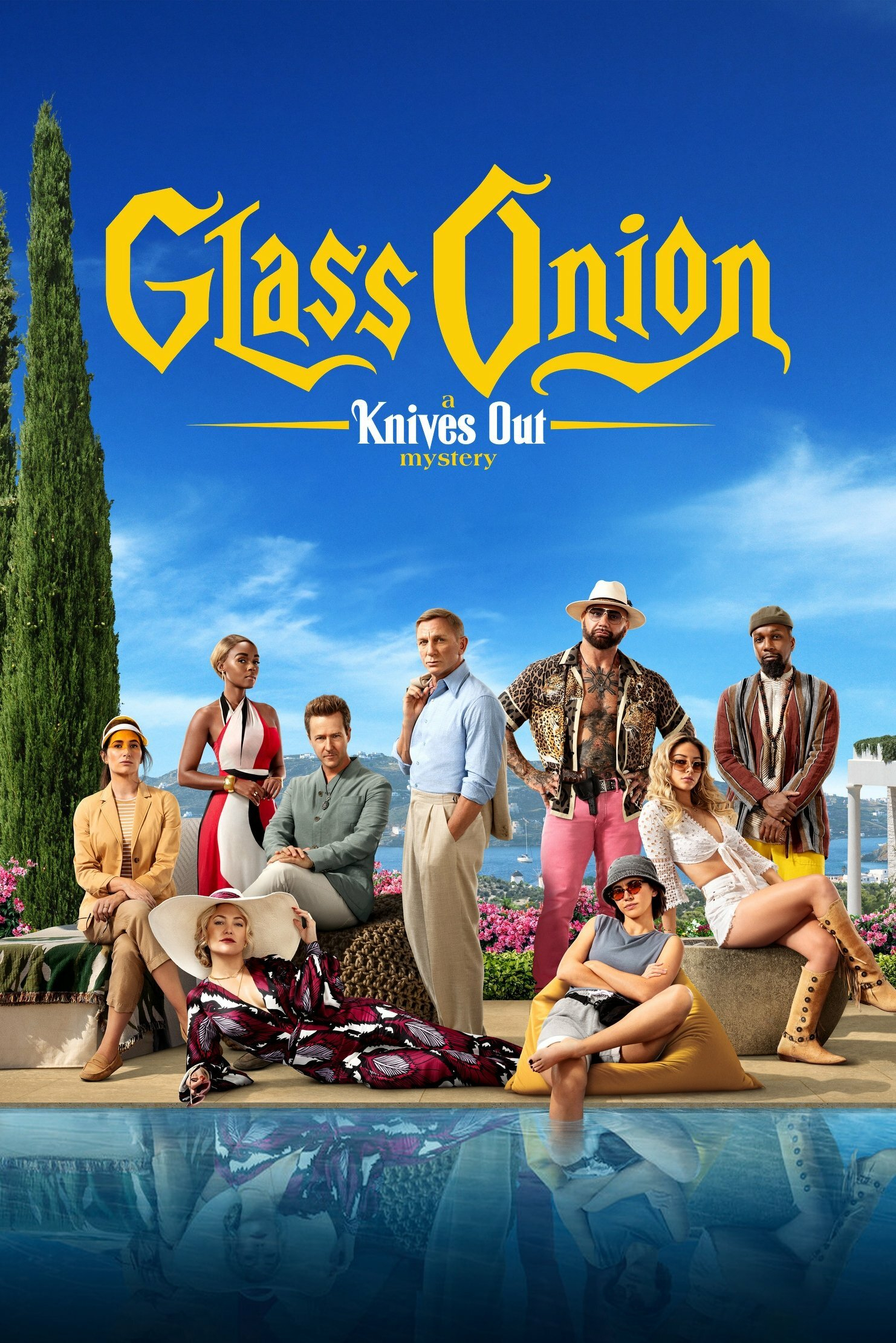 Poster for "Glass Onion: A Knives Out Mystery" featuring a group of characters standing and sitting in an outdoor setting by a pool. They are dressed in a variety of stylish outfits. The title is prominently displayed in ornate yellow lettering against a clear blue sky.