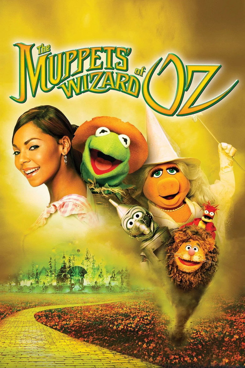 A promotional poster for “The Muppets’ Wizard of Oz” features a bright yellow and green background with a golden path leading to the Emerald City in the distance. On the left, a smiling woman with medium brown skin and straight, dark brown hair is dressed in a pink and white checkered top. Beside her are several Muppet characters: Kermit the Frog dressed as the Scarecrow with a brown hat, Miss Piggy as Glinda the Good Witch holding a star-tipped wand, Gonzo as the Tin Man with a silver funnel hat and metallic body, Fozzie Bear as the Cowardly Lion with a bushy mane, and Pepe the King Prawn perched on Fozzie’s head wearing a red shirt. The title “The Muppets’ Wizard of Oz” appears prominently at the top in large green and gold letters with whimsical, curved lettering. The overall poster has a magical, whimsical feel with warm glowing colours.