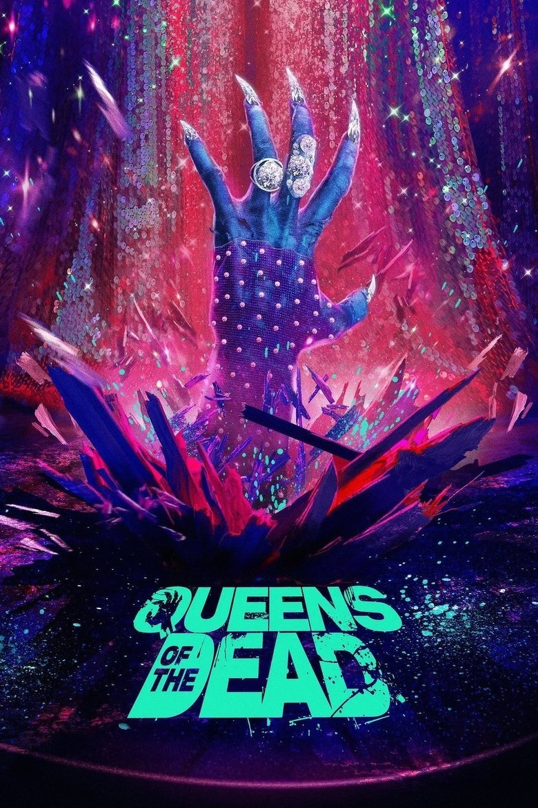 A dramatic, colourful image featuring a blue hand with long, sharp, silver nails and adorned with large, sparkling rings emerging from a burst of vibrant, jagged shards of pink, purple, and blue. The background is a cascade of glittering, sequin-like textures in shades of red, purple, and teal, with scattered glowing particles creating a cosmic, otherworldly effect. At the bottom, the bold, glowing turquoise text reads “QUEENS OF THE DEAD,” with “OF THE” nested within the larger word “DEAD.” The overall design is vivid, dynamic, and theatrical, evoking a supernatural or fantasy theme.