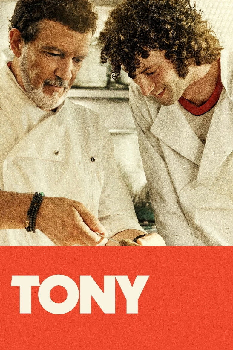 Two chefs in white uniforms are standing close together in a kitchen, smiling as they focus on preparing food. The older chef with short dark hair and a grey beard is holding a spoon, wearing a bracelet on his wrist. The younger chef with curly dark hair leans in to observe. The lower part of the image has a solid orange background with the large white text “TONY” written in bold capital letters.