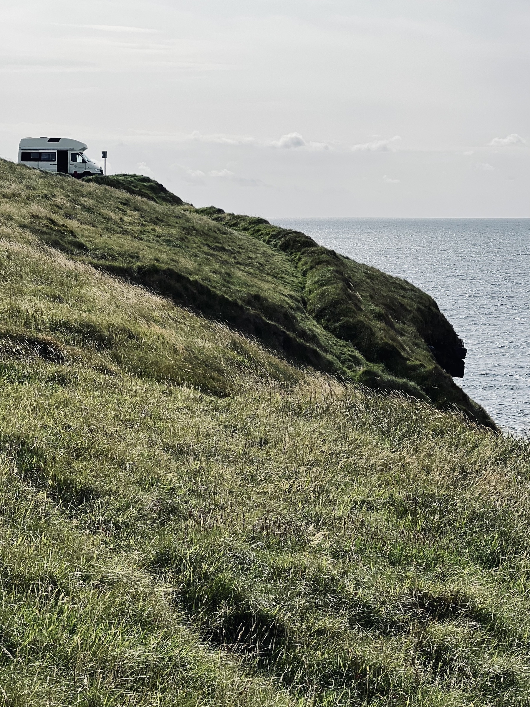A room with a view. Camper van overlooking the sea.&10;
