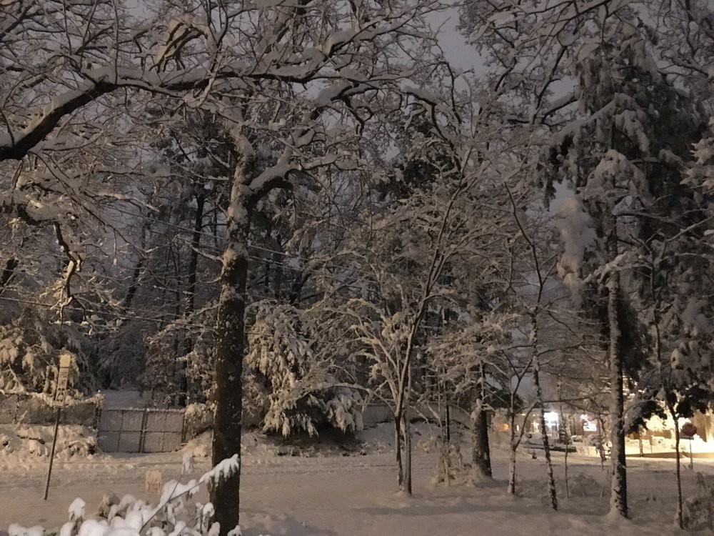 Front street snow scene by night