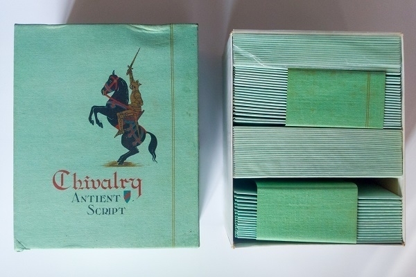 A box of vintage 'Chivalry Antient Script' envelopes in jade green.