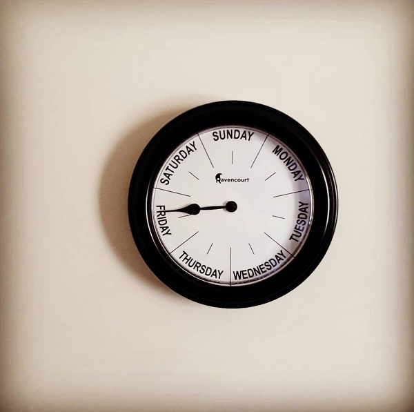 Seven-day wall clock.