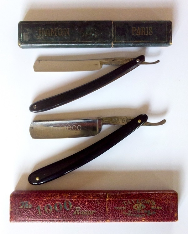 Two straight razors and their original boxes.