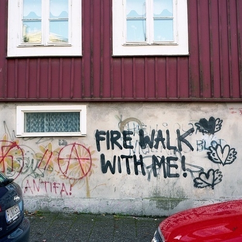 Spray-painted graffiti text reading 'Fire Walk With Me!'