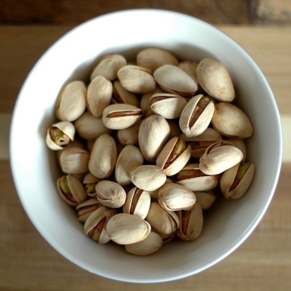 A bowl of roasted & salted pistachios,