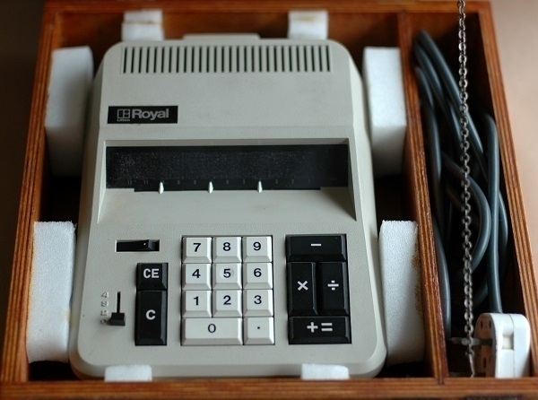 A ca. 1972 Royal IC-130 calculator in an apparently custom-made wooden case.