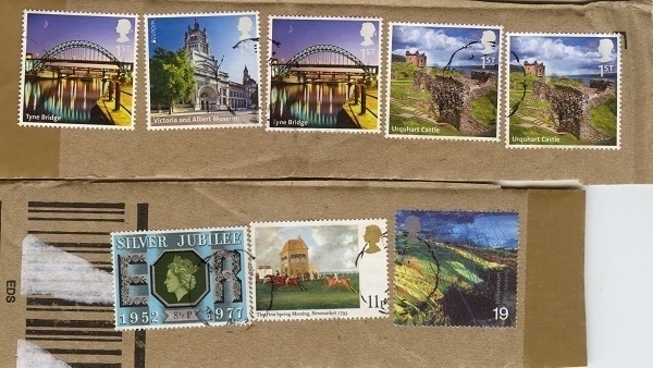 An assortment of postage stamps as were affixed to a parcel.