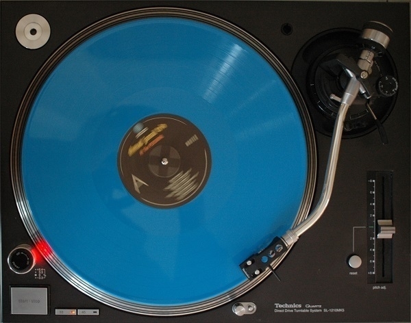 Plan view of a Technics SL-1210Mk5 turntable with an LP playing on it.