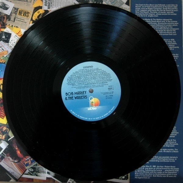 A copy of the 'Legend' compilation by Bob Marley and the Wailers on top of the right-hand panel of the inner gatefold.