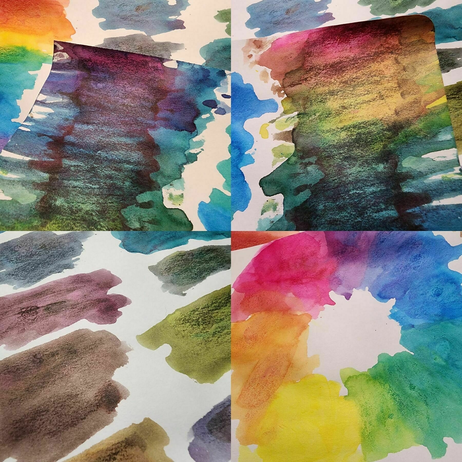 Close up collage of rainbow ink swatches, some bright colors and some darker, mixed with black ink.