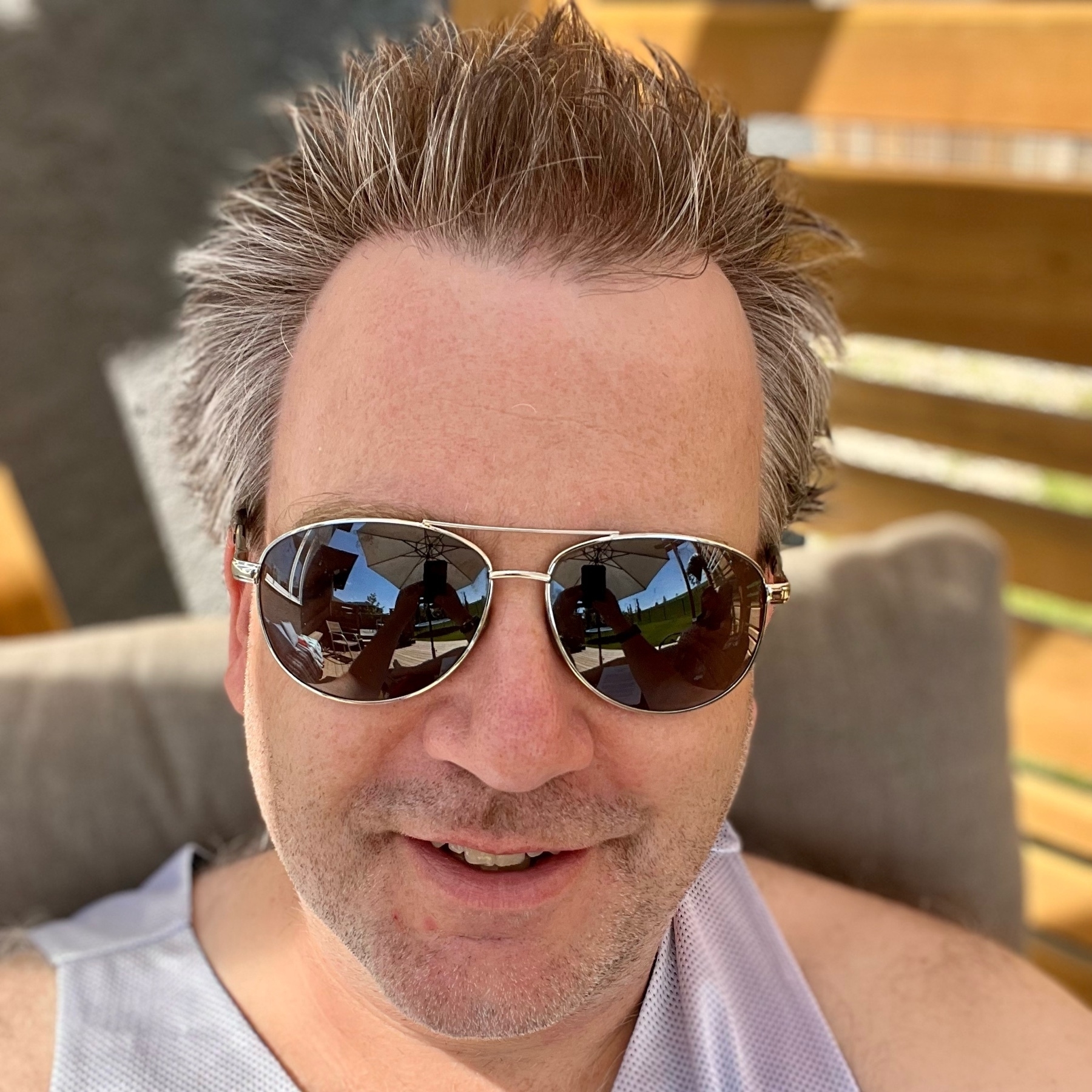 selfie of Chris with hair spiked out and sunglasses on. 