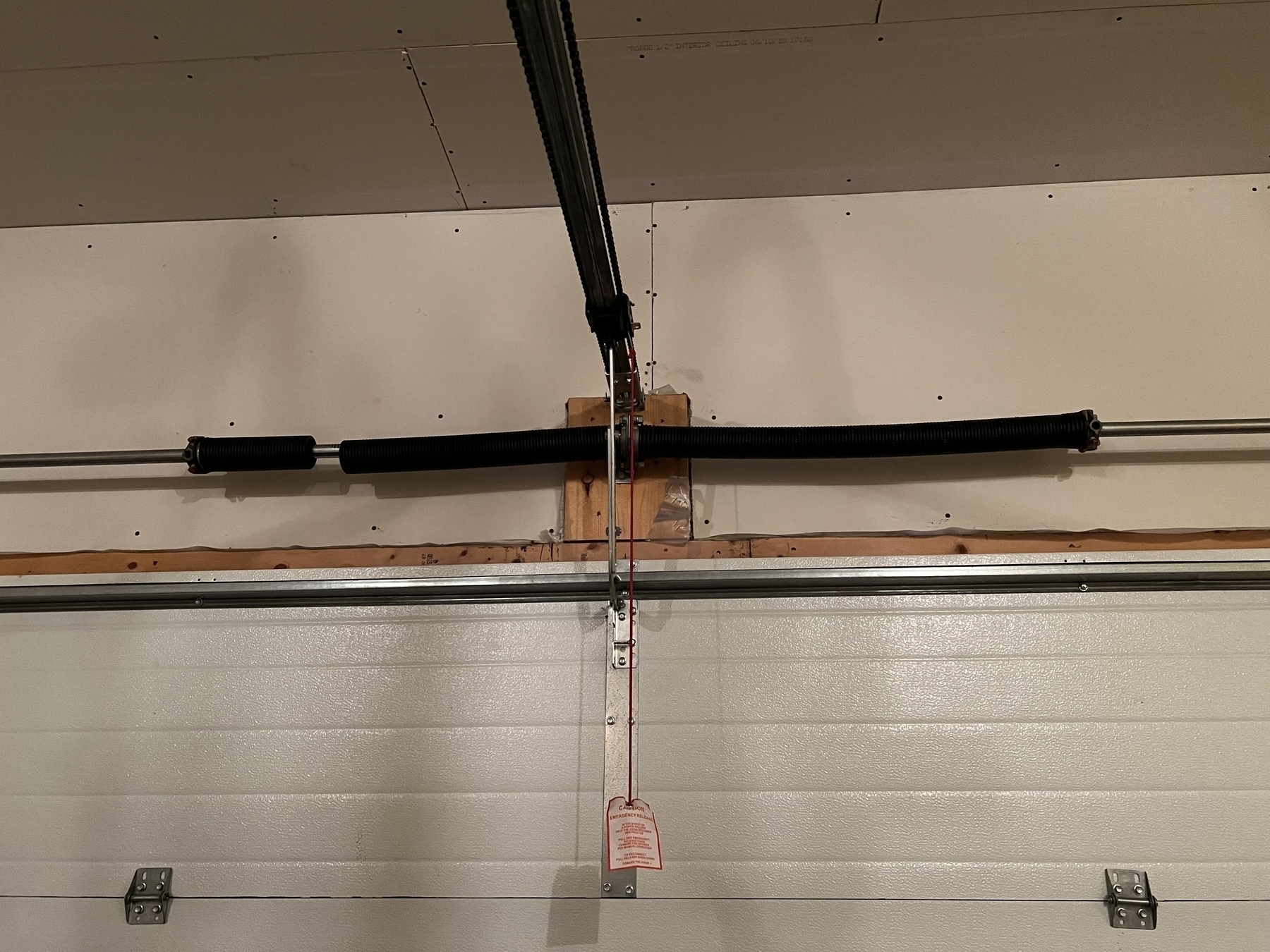 View of a garage door spring with it separated into two parts sort of?