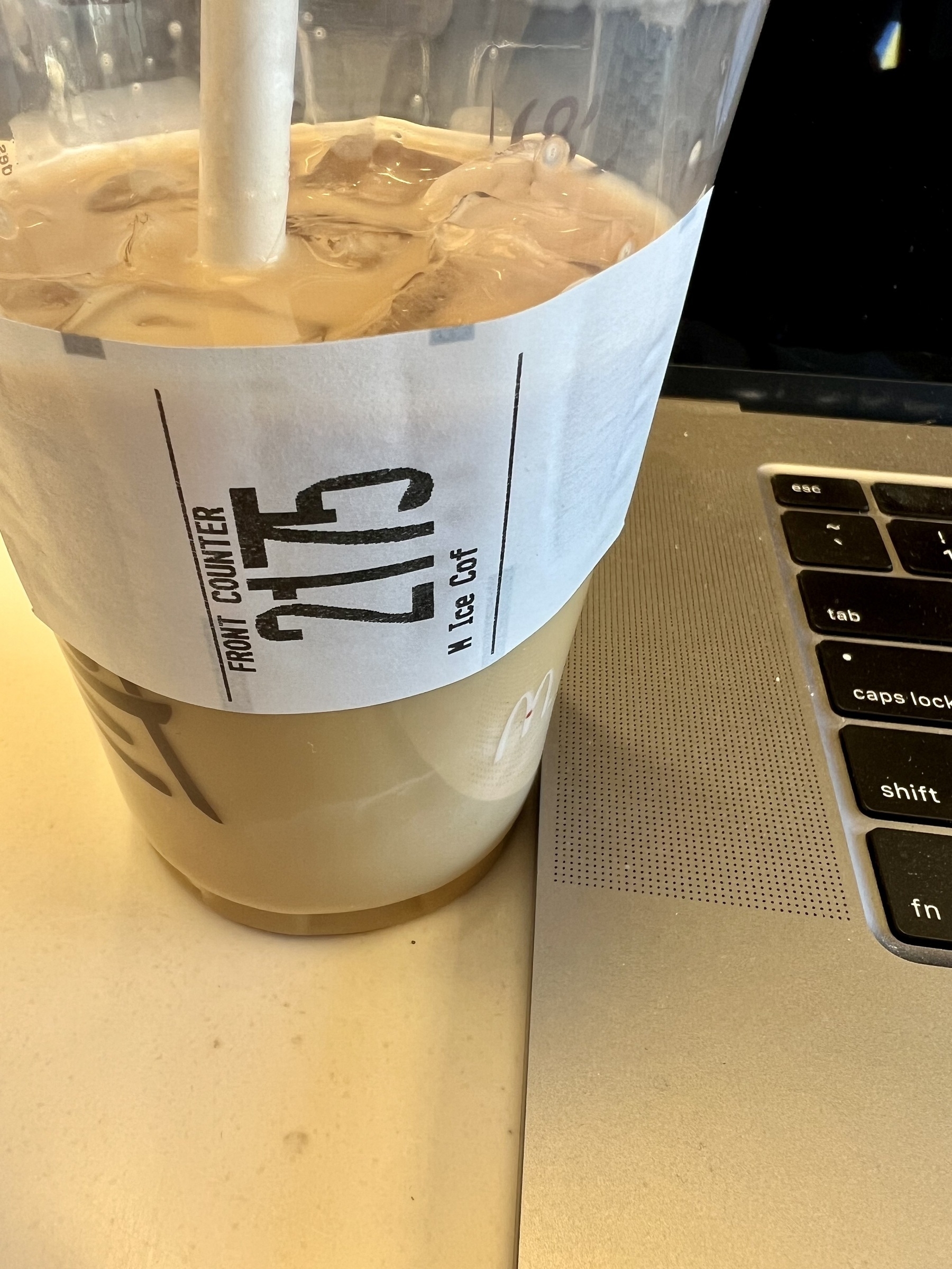 An iced coffee drink with the number 2175 on the side and “ice cof” as the description on the label. 