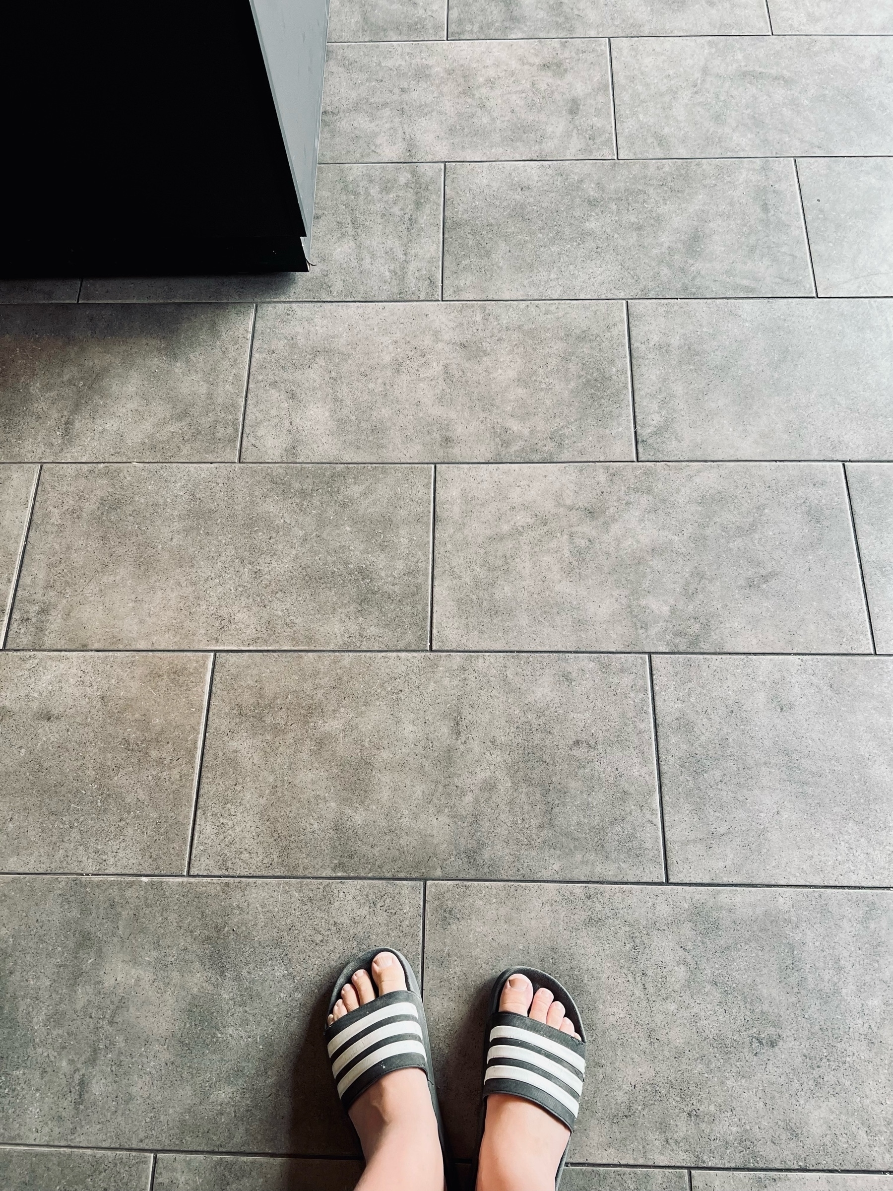 floor of a coffee shop + my feet